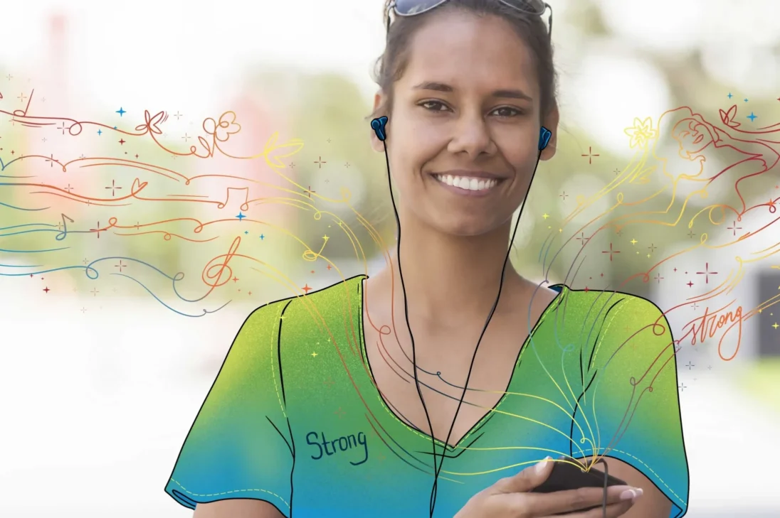 Image of a woman listening to music through earphones. She feels strong listening to the. music.